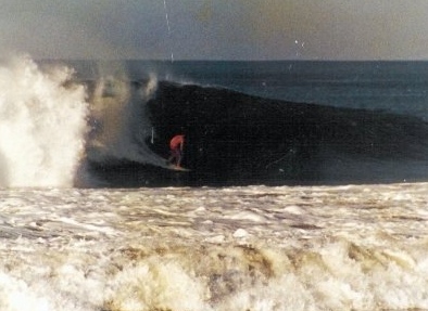 English teacher Paul Batcheller surfs in Manhattan Beach
