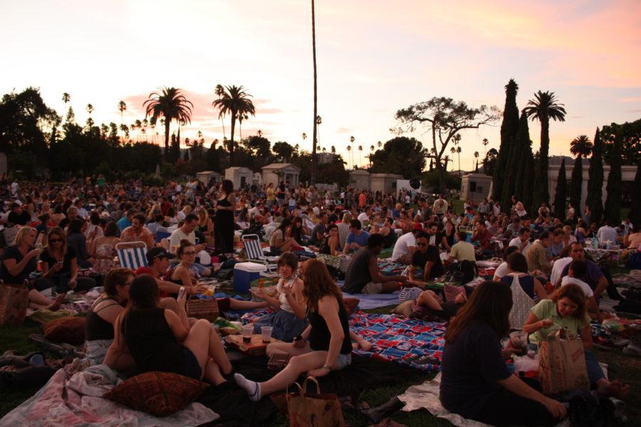Movie goers picnic in the Hollywood Forever Cemetery while waiting for CInespias screening of The Graduate.
