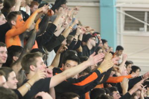 Students cheer in unison at the Samo game.