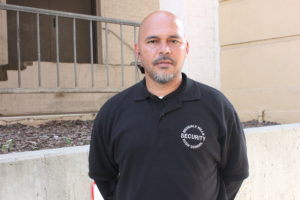 Edison Locke stands outside the Salter Family Theatre, working as a security guard.