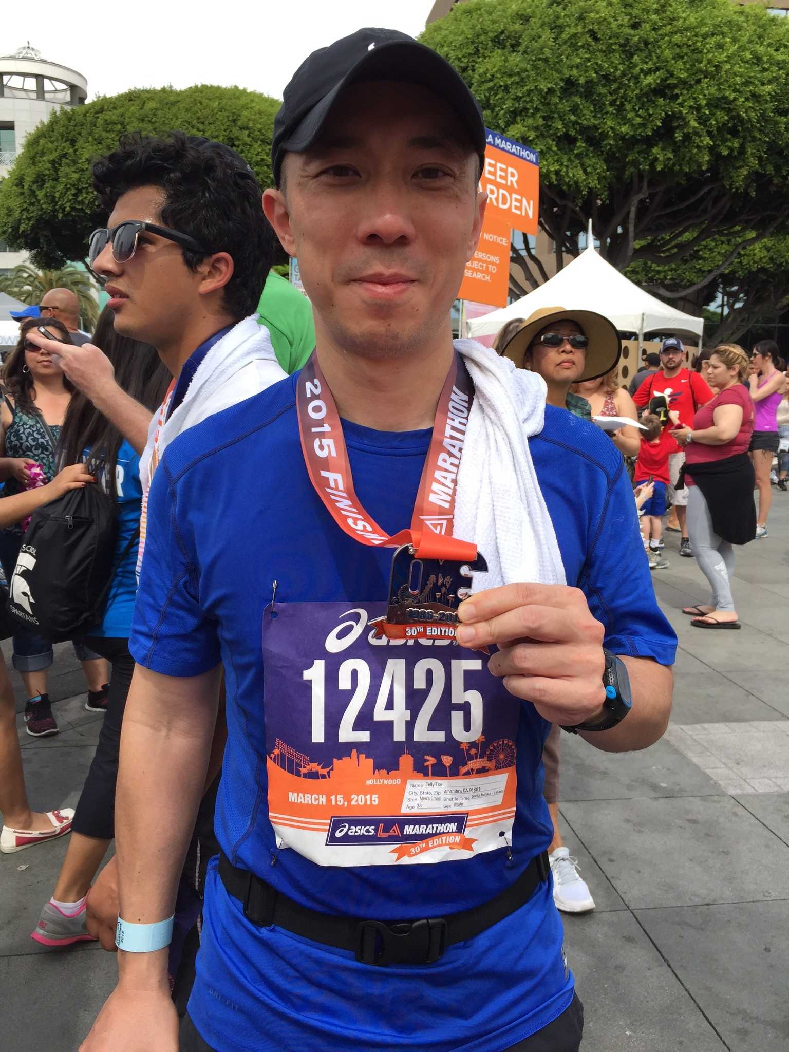 Tse poses with his medal after the race. Photo by: TONIA TSE