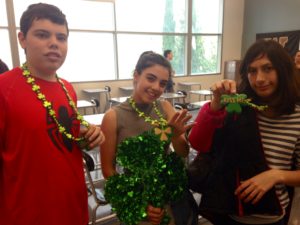 TUCH president Lauren Moghavem and club members Steven Birnbaum and Rona Simoni show their St. Patrick's Day spirit at the clubs lunch meeting.