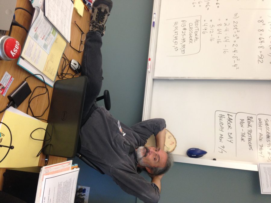 Teacher Jeff Berkeley relaxes in his chair after school hours.
