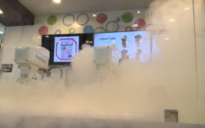 White smoke rises from the Creamistry ice cream machines as a creation is being made.