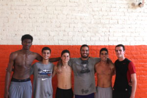 Artest (left) and teammates on the varsity basketball team pose before practice. Photo by: GUY GINSBERG