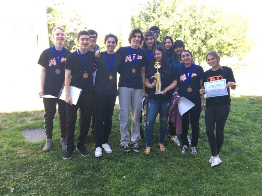 Eleven students from Advanced Journalism and one student from Beginning Journalism stand with their awards after the LAJTA write-off.  Photo by: Gaby Herbst
