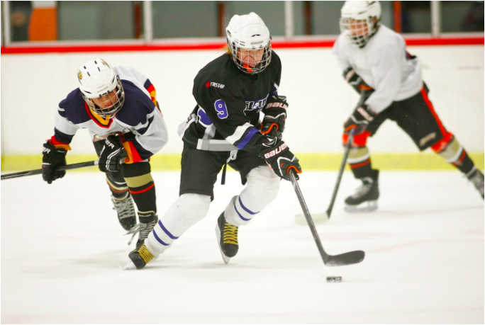 Sophomore Dominique Petrie skates past the opposing team in a game last week. Photo courtesy of: DOMINIQUE PETRIE