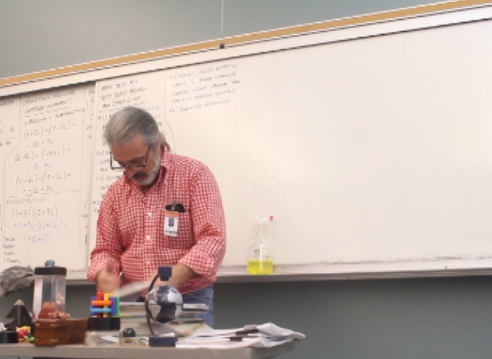 Jeff Berkeley reviews answers from last nights homework with his students. PHOTO BY: Sophia GOldberg