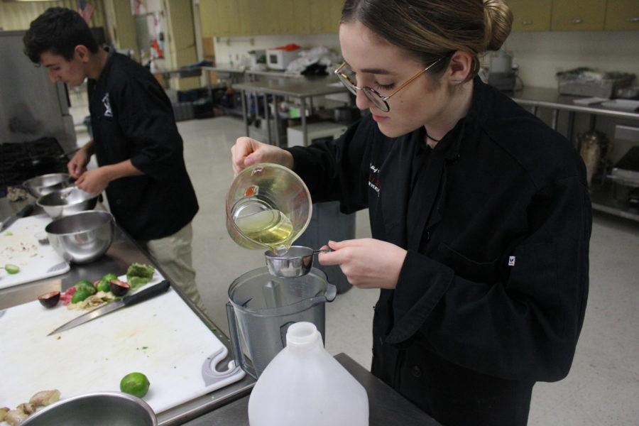 Culinary student Lea Lefkovics begins making her Asian style beef salad for her class mystery box final.