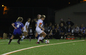 Dani Elitzur dodges defenders and brings the ball down the field. Photo by: Priscilla Hopper