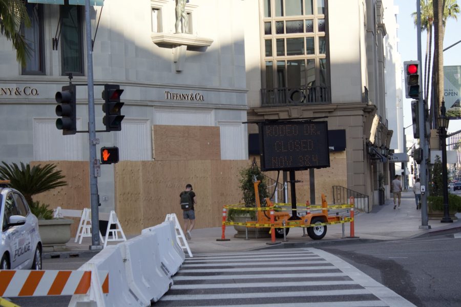 Police implement blockades to prevent cars and pedestrians from entering Rodeo Drive. 