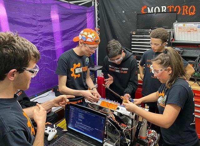Current and former members of the BHHS Robotics team at competition in March 2020. Photo courtesy of Ella Cox.