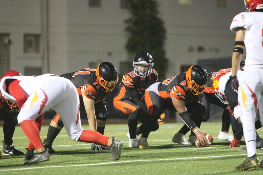The Normans work together as they face the Hawthorne Cougars on Oct. 22. The homecoming game marked the last home game of the season.
Photo by: Candice Anvari
