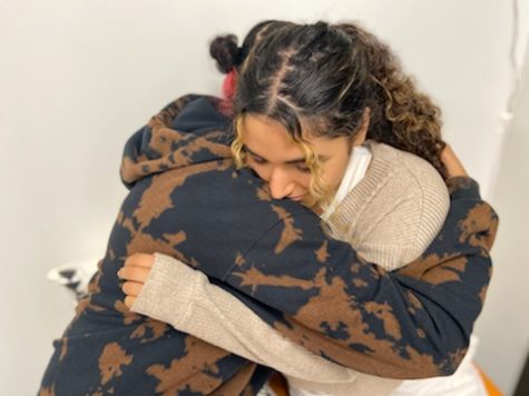 Junior Jory Kanaan comforts sophomore Jasmine Mehdizadeh. “Sometimes I just need a friend to be there,” Mehdizadeh said. Photo by: Shayda Dadvand