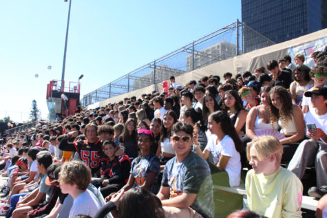 Students find their way to their designated grades section on the bleachers to watch this years pep rally, like the freshmen shown.	
Photo by: Kate Oller