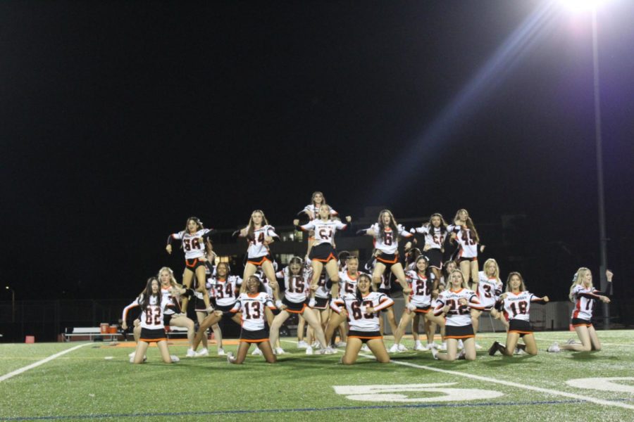 Cheer performs at the homecoming game halftime show.