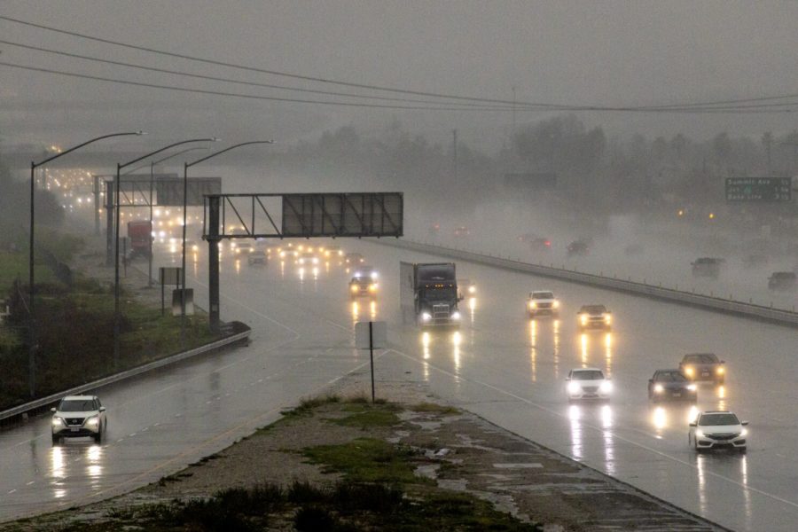 Rain+pours+onto+a+freeway+in+California%2C+leaving+the+roads+dangerous.%0APhoto+from%3A+The+LA+Times