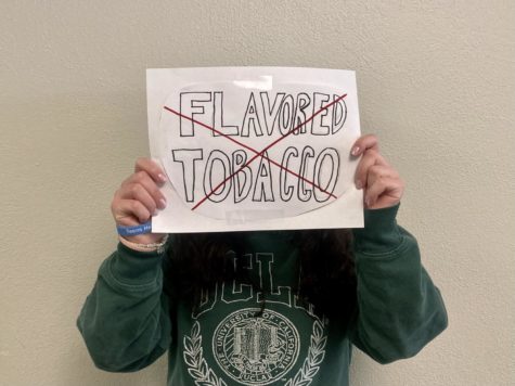 Sophomore Pariss Chami holds a sign against flavored tobacco use.
Picture by: Kate Oller