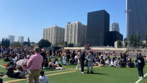 Students gather in their designated areas to wait until the fire drill is complete. 