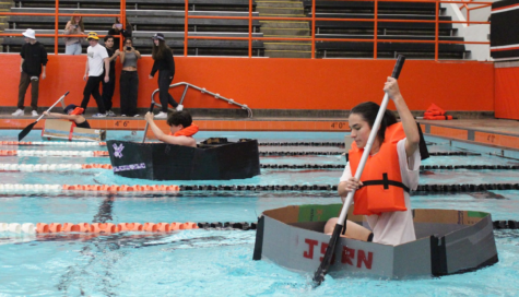 Seniors Danielle Hollander, Andrew Kim and Rebecca Katz (pictured from left to right) race each other in the senior boat race. 