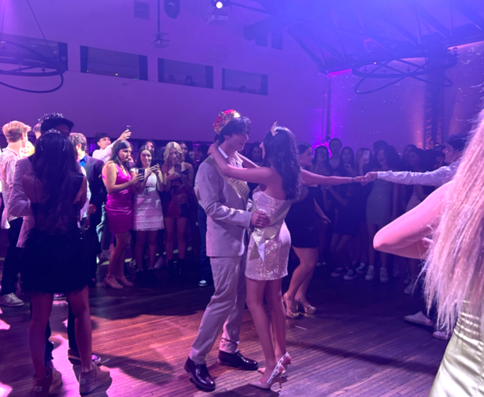 Seniors Caio Azevado and Diya Tuli dance after they are crowned Homecoming Queen and King.
