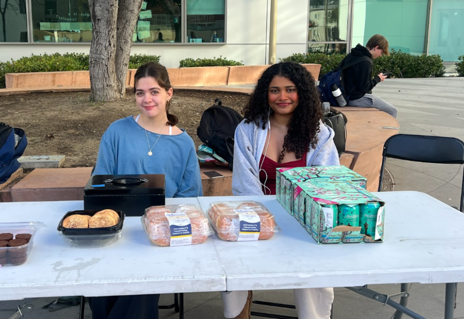 Hallema Bakhda and Bella Naufal participate in the Homeless Aiding Society fundraiser, selling yummy treats to help raise awareness and money towards the homeless.